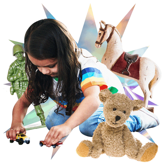 Little girl playing with the old cars, bear, soldier and a horse - old toys saved from childhood