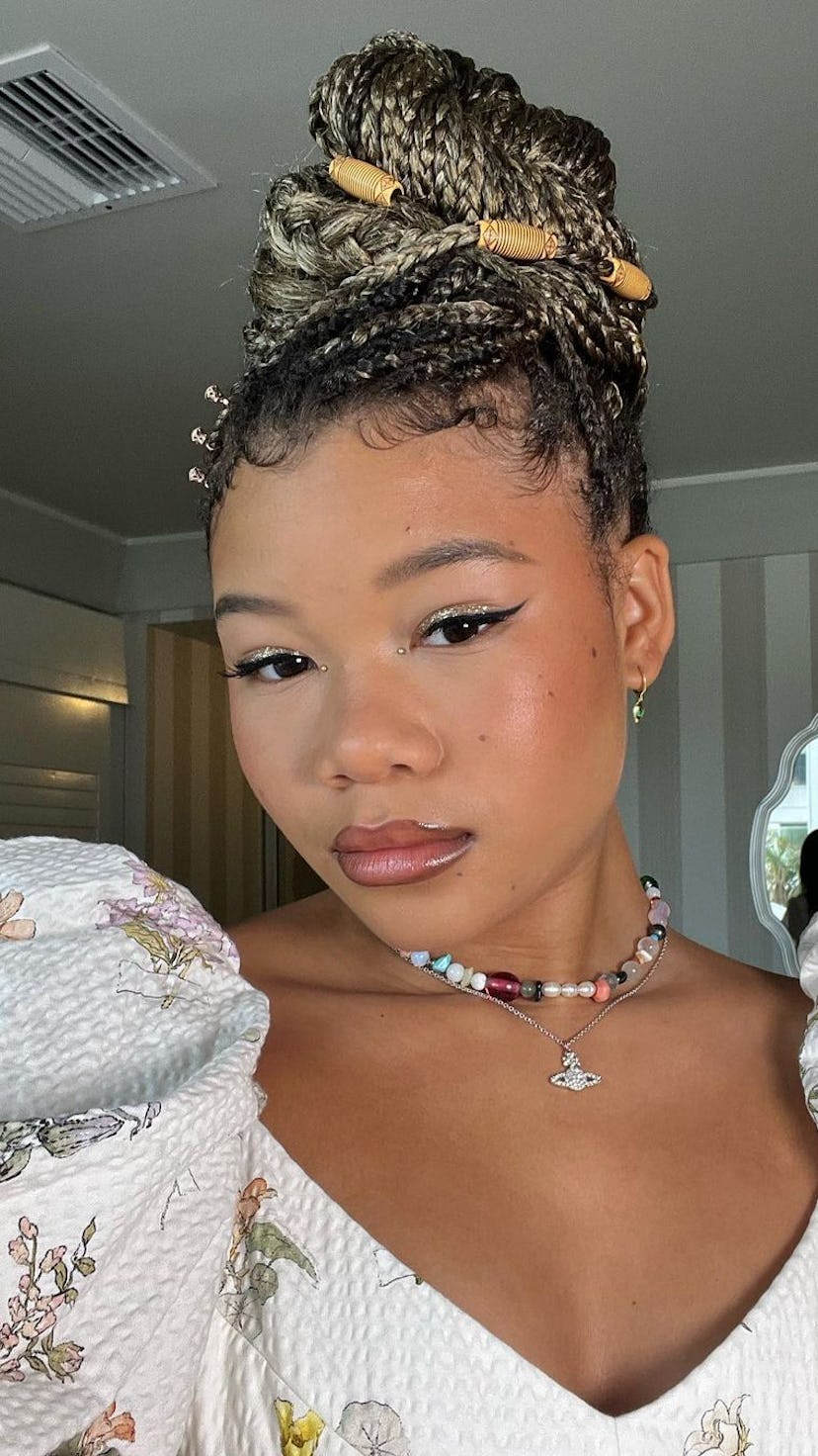 Storm Reid in box braid ombre bun with beads