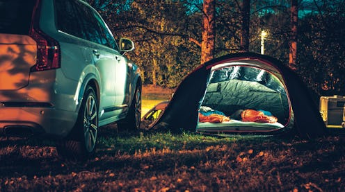 Tent set up at campsite with a sleeping pad for car camping