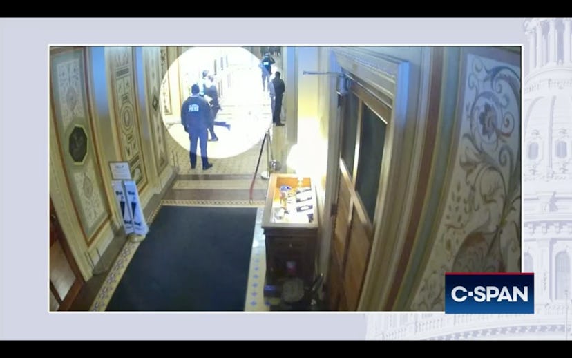 A screenshot of video shared by the House Jan. 6 committee that shows Missouri Sen. Josh Hawley flee...