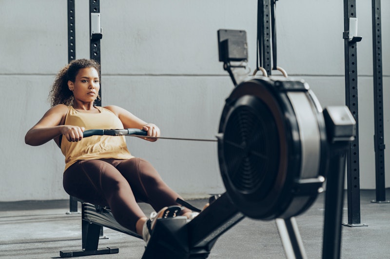 Here's how to row properly on a rowing machine, according to pros.
