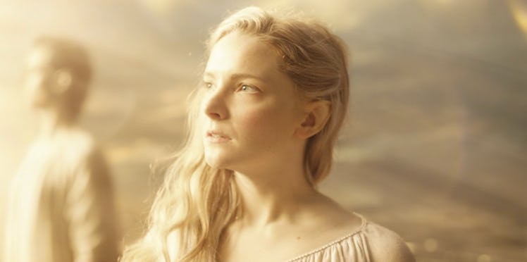 Galadriel (Morfydd Clark) looks toward a bright light source in The Lord of the Rings: The Rings of ...