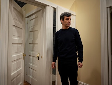 A still from The Rehearsal; Nathan Fielder is standing in a hall with many doorways