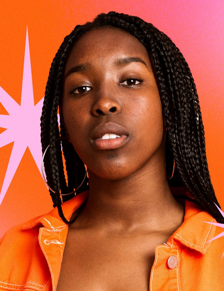 Model posing with neutral makeup and amazing braids