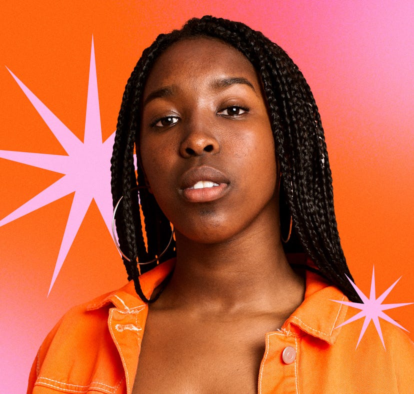 Model posing with neutral makeup and amazing braids