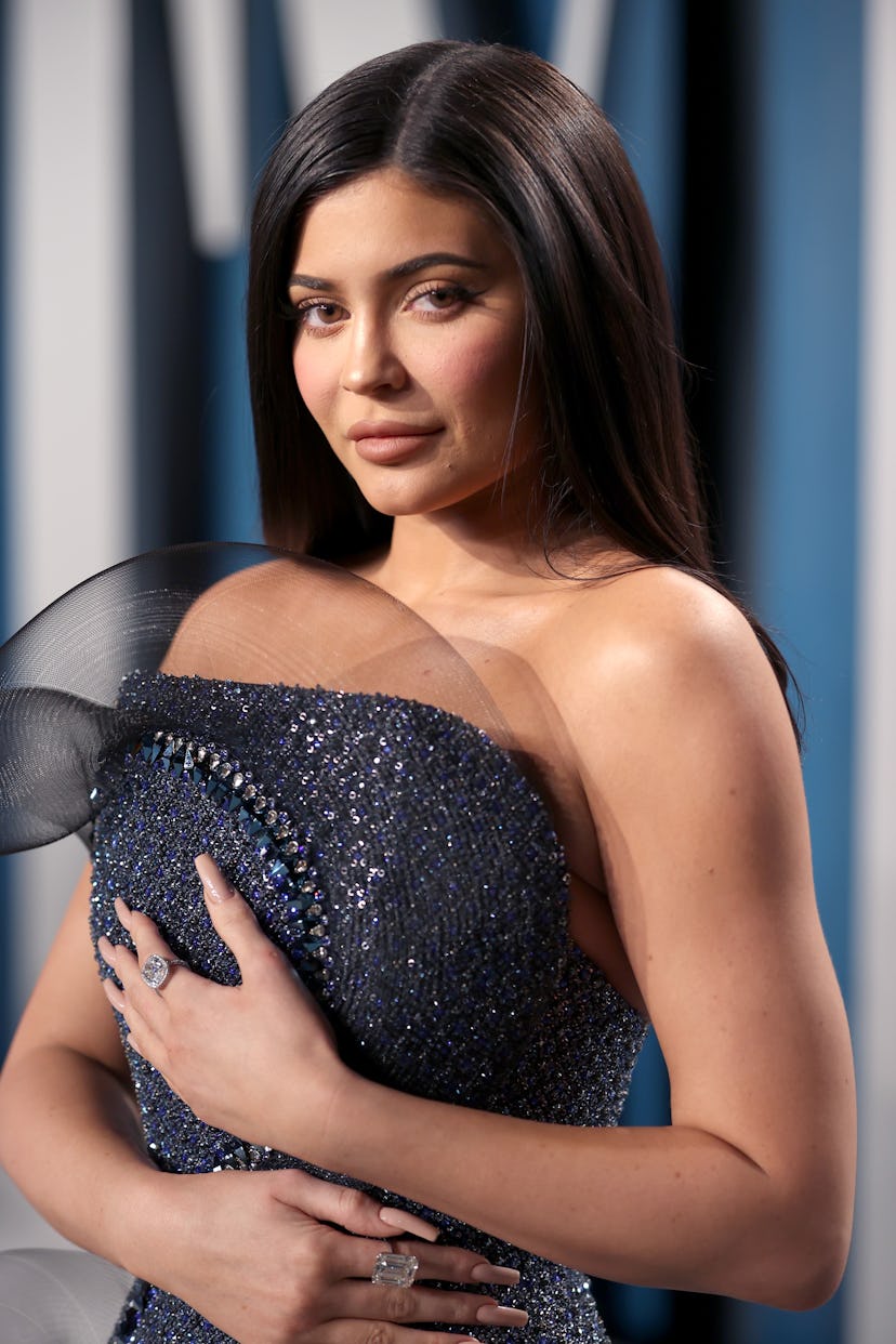 Kylie Jenner posing in a blue sequin dress for an Instagram post