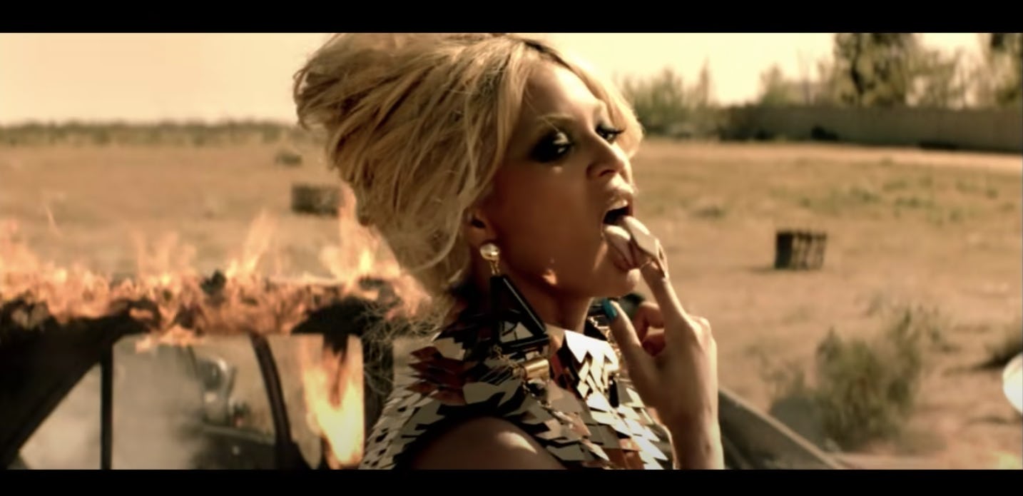 Beyoncé wears a tousled beehive hairdo in the &ldquo;Run the World&rdquo; music video.