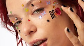 a model wears joystickers from af94, Halsey's new, affordable beauty brand.