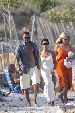 david beckham and his wife victoria leave the beach at saint-tropez