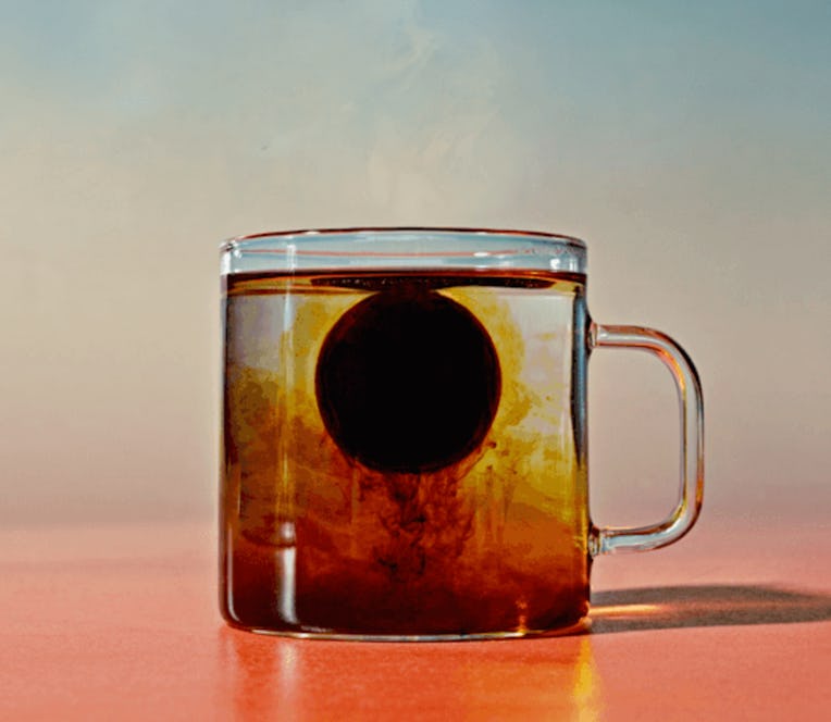 Coffee pod in transparent mug.