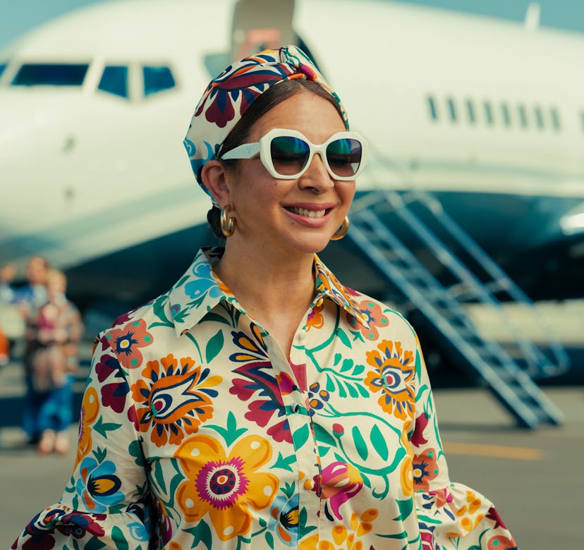 Molly wearing floral dress in 'Loot'