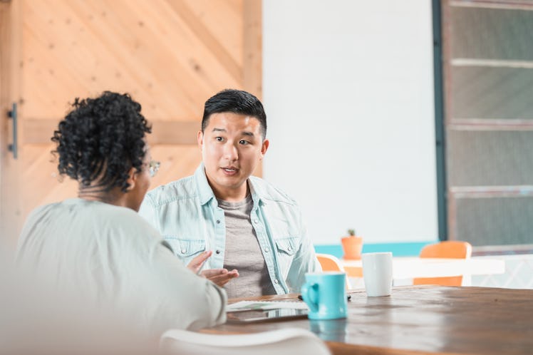 Couple having serious discussion at table