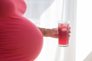 Eating ice while pregnant is typically harmless and pretty common, says an OB-GYN.