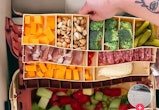 On TikTok, users are getting fishing tackle boxes to use as a way to pack charcuterie on-the-go.