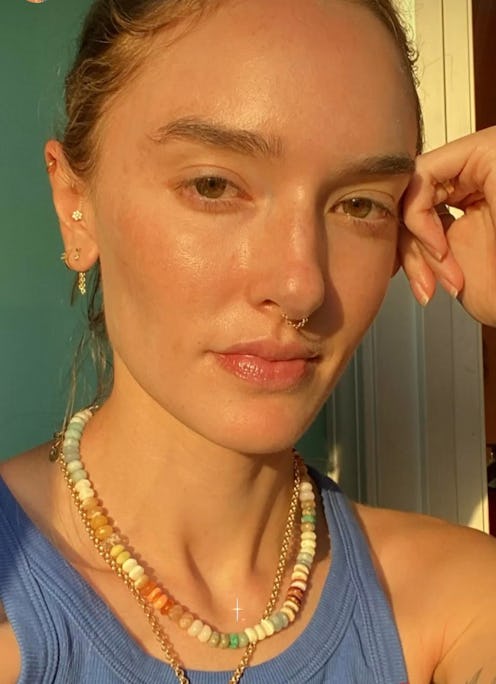 hannah wearing a colorful gemstone necklace