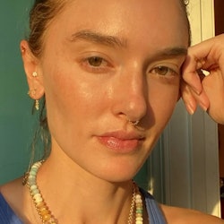 hannah wearing a colorful gemstone necklace