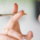 Close up of a woman smoking weed.