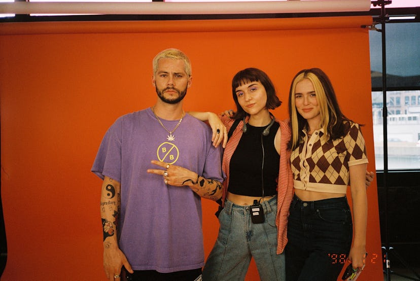 Dylan O'Brien, Quinn Shephard, and Zoey Deutch, pose on set of the 'Not Okay' movie.