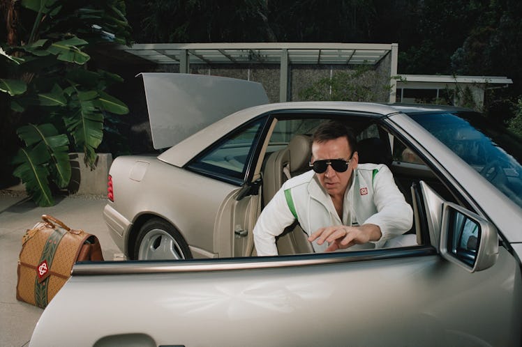 Nicolas Cage getting out of a car in a Casablanca campaign