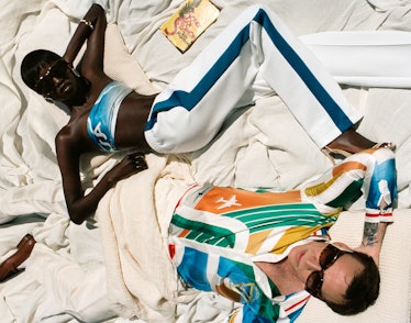 Anok Yai and Nicolas Cage lying down in a Casablanca campaign