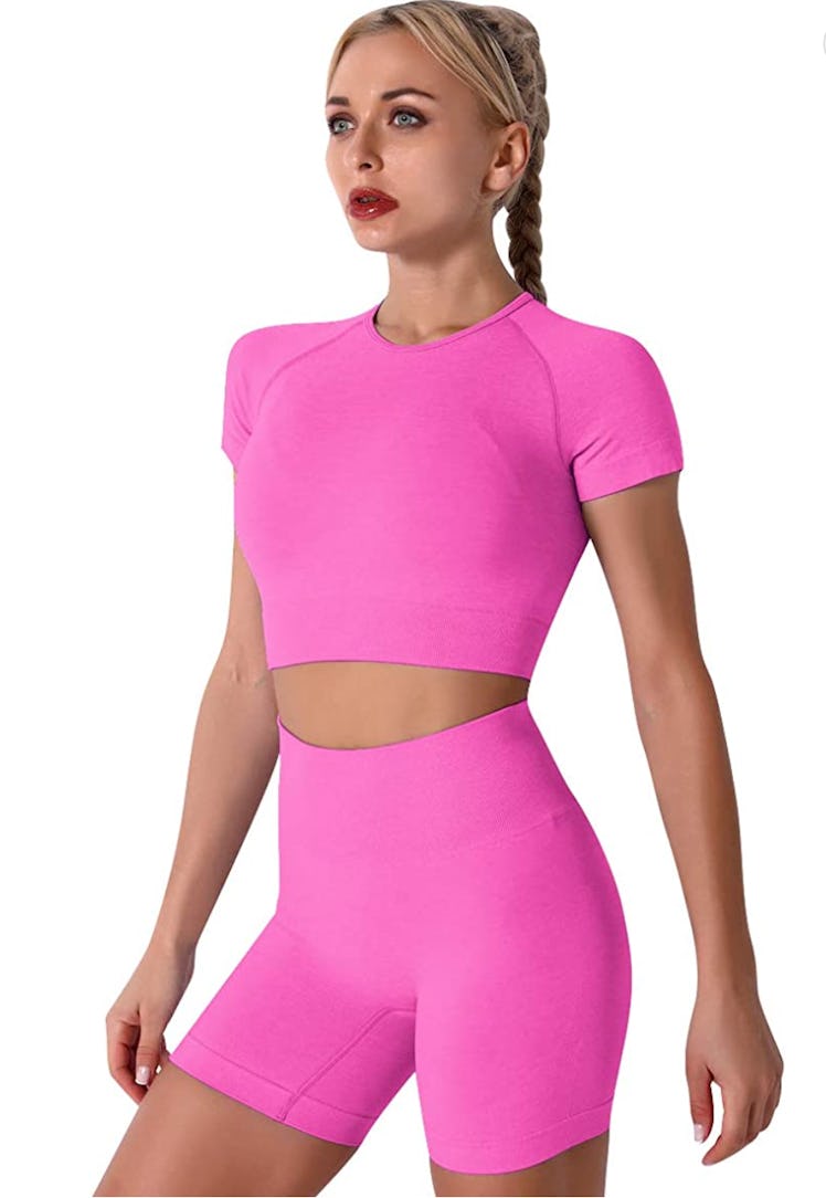 A seamless, pink workout crop top and bike shorts from Amazon.