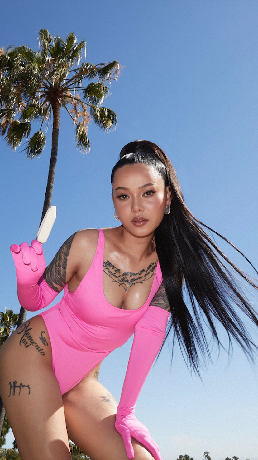 Bella Poarch modeling SKIMS' new, 2022 swimwear collection.
