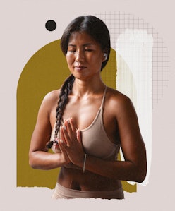 A brunette woman with her hands in a praying position during her meditation practice for coping with...
