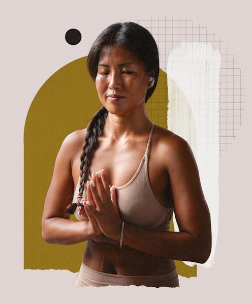 A brunette woman with her hands in a praying position during her meditation practice for coping with...