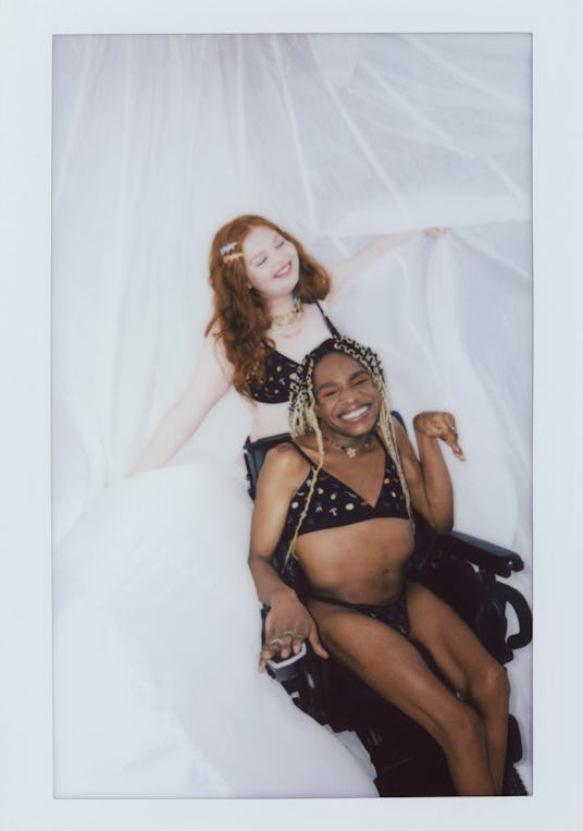 Taken on a Polaroid film camera, there are two people wearing the black bra and thong Urban Outfitte...