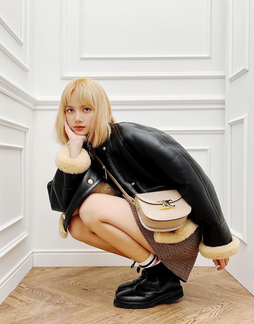 Blackpink's Lisa with Celine Triomphe bag.