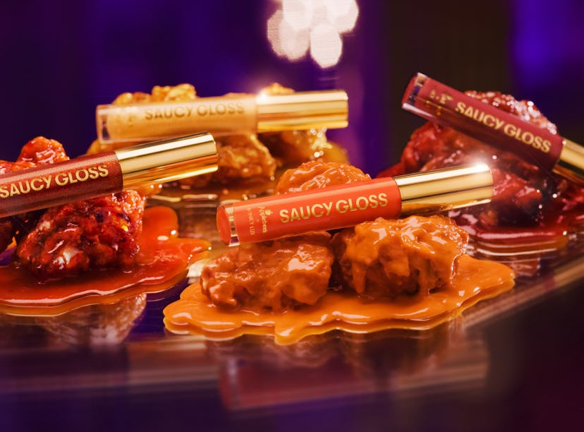 Here's where to buy Applebee's wing sauce lip glosses that are scented to smell like chicken wings..