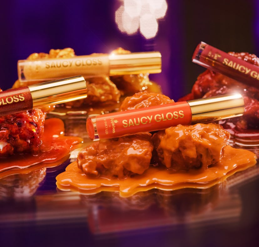 Here's where to buy Applebee's wing sauce lip glosses that are scented to smell like chicken wings..