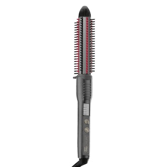 This ceramic hot curl brush styles bangs with heat.