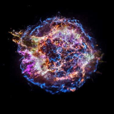 An orb filled with many colorful strands and rings. This is the remnant of a supernova, and it is ca...