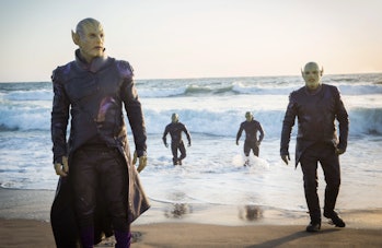 A group of Skrulls stand on the beach together in Captain Marvel