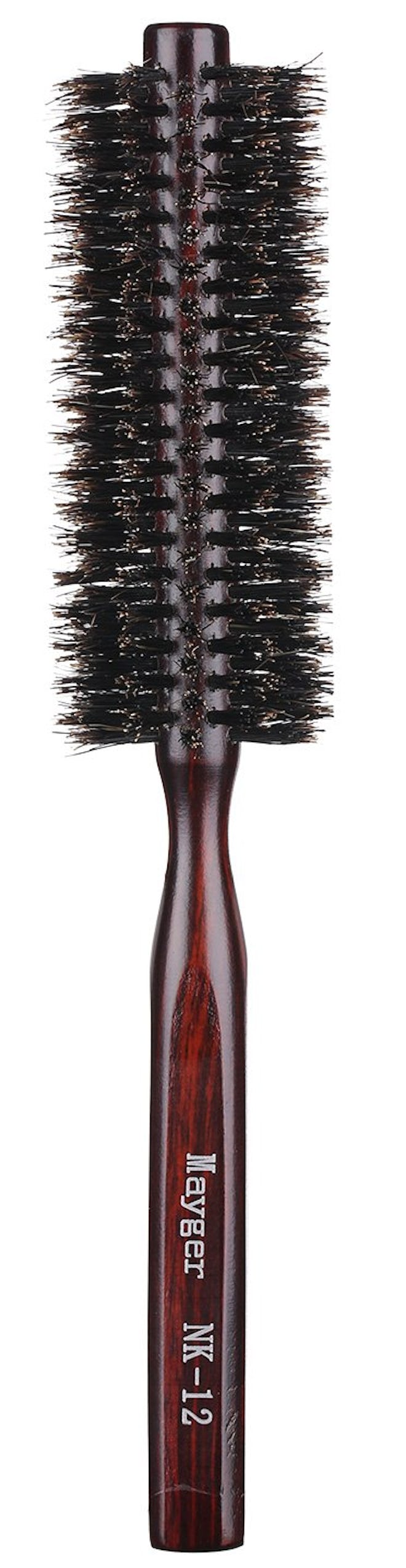 This round brush for bangs is made from boar bristles for volume and curl.