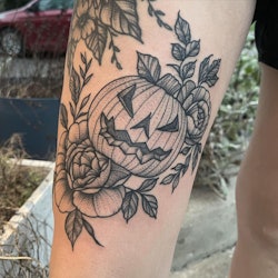 A jack-o-lantern Halloween tattoo