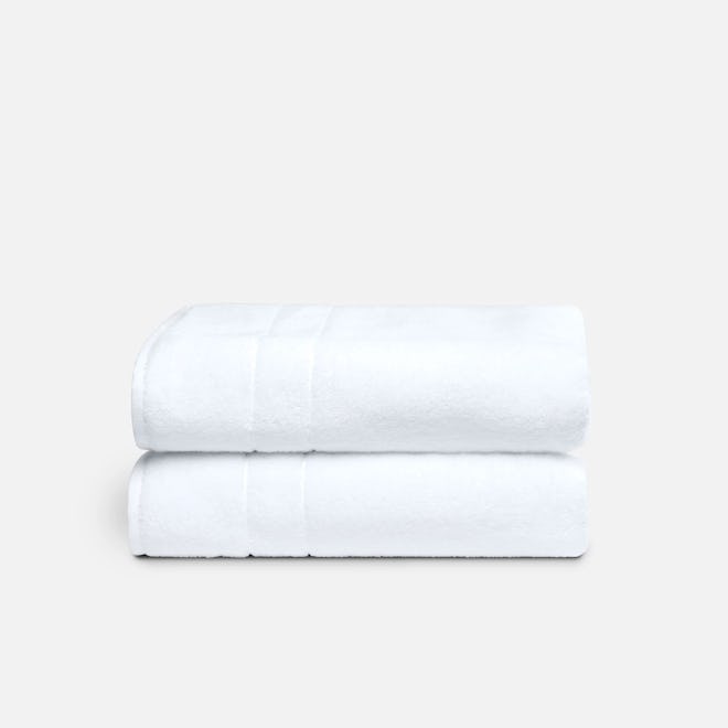 two super plush bath towels in white