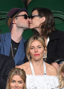 Alexa Chung and Sienna Miller and Tom Sturridge at a tennis match