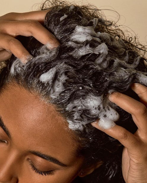 woman washing hair and scalp