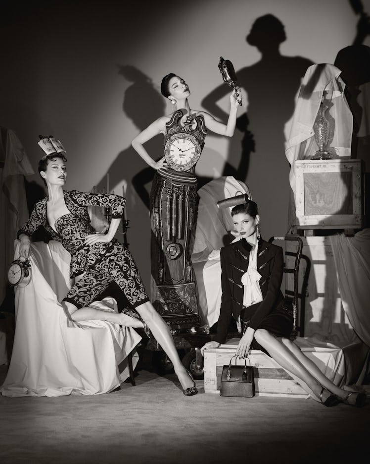 A black-and-white Moschino couture campaign featuring three models