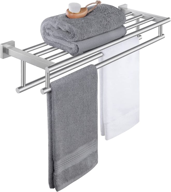 bathroom hotel bath towel rack with towels on it