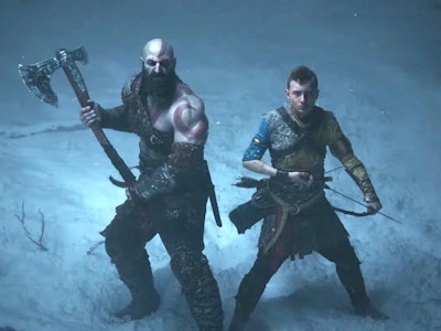 Kratos and Atreus standing in the snow, ready to battle