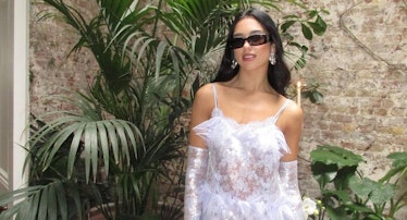 Dua Lipa in a white lacy dress