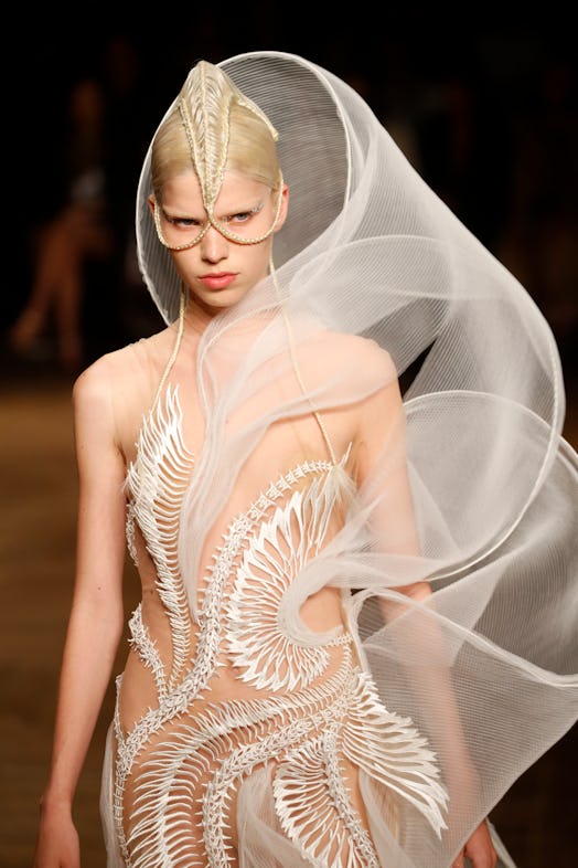 A model walks the runway during the Iris Van Herpen Haute Couture Fall Winter 2022 2023 show as part...