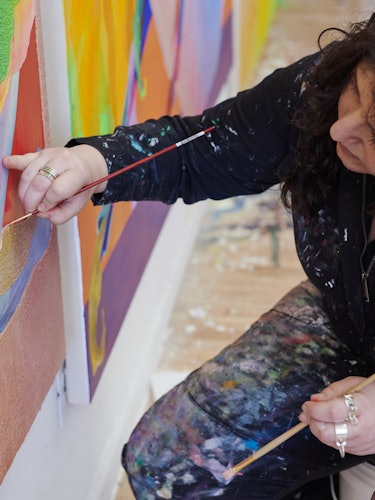Ilana working on her paintings