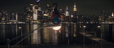Kamala Khan (Iman Vellani) sits atop a streetlight in Ms. Marvel