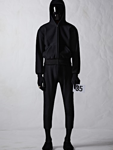 A model in a black Balenciaga hoodie and sweatpants