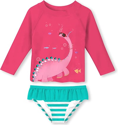 Toddler swimsuits under $25 include this cute pink dinosaur set.