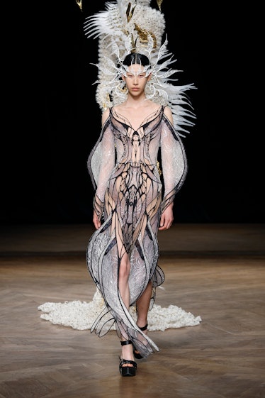 A model walks the runway during the Iris Van Herpen Haute Couture Fall Winter 2022 2023 show as part...